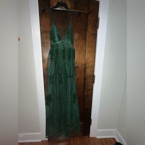Dark green tulle maxi dress that features a deep v and open back